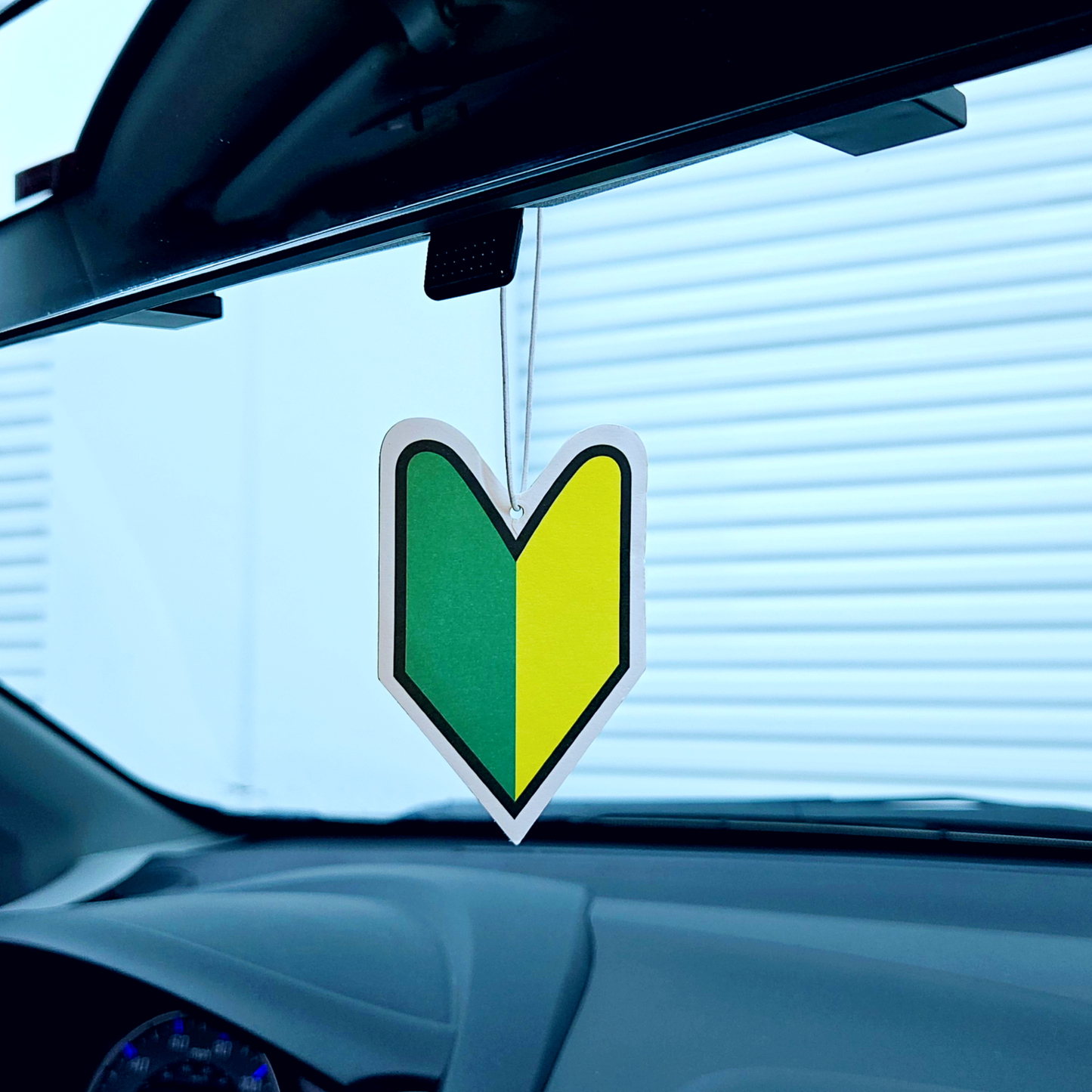 jdm leaf and freshener hanging in rear view mirror